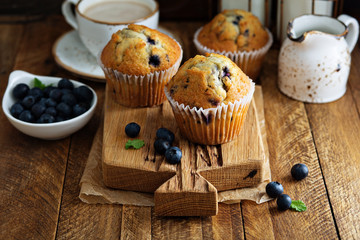 Freshly baked blueberry muffins in a rustic setting