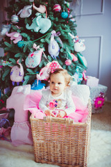 Fototapeta premium The small girl sits in basket