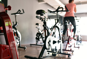 Young girl is doing sport Spinning in the gym for fitness