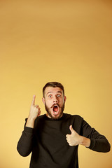Portrait of young man with shocked facial expression