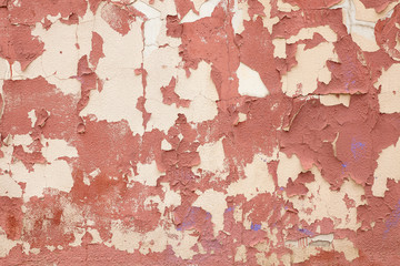 The old red cement plaster on the wall