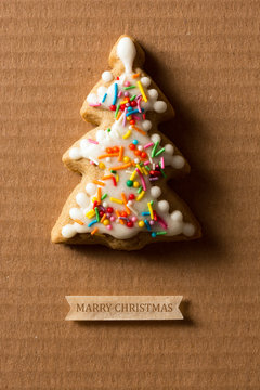 A postcard with a picture of a cookie Christmas tree