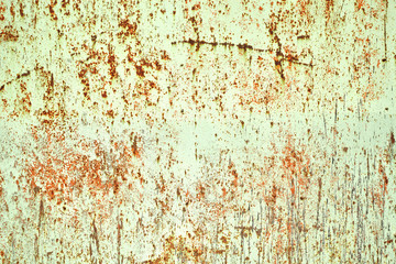old rusty metallic surface painted wall with peeling paint chipp