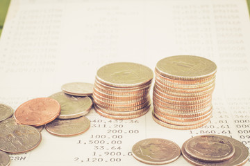 Coin stack on account book bank with retro color effect