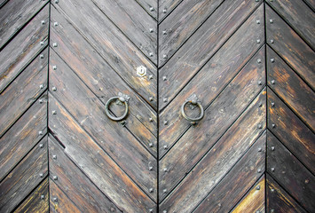 Details of an ancient Italian door in Florence, Italy.