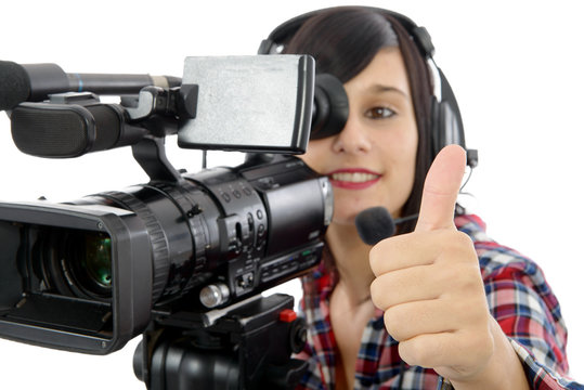 pretty young brunette girl with a professional camcorder, on whi