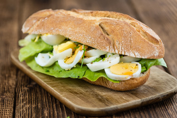 Portion of sliced Eggs (on wood)