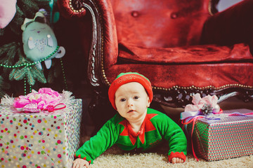 beautiful portrait of cute little boy with gift boxes