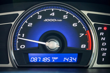 Speedometer in parked car, with LCD display of odometer and trip calculator