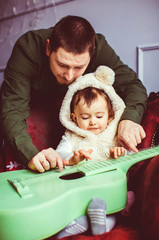 happy father stands near his cute and wonderful doughter