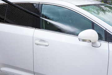 Plakat car wash - washing car with high pressure water
