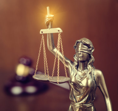 Statue of justice and Wooden gavel, law concept