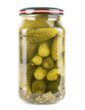 Pickled cucumbers in a glass jar isolated on white background