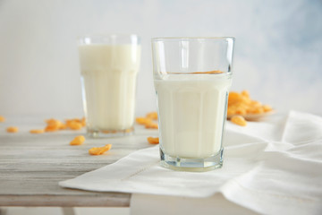 Delicious milkshake in glass on table