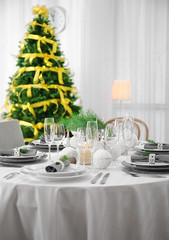 Table served for Christmas dinner in living room