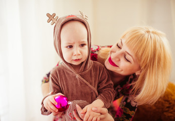  woman spending time in the studio with her wonderful newborn ba