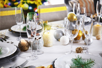 Table served for Christmas dinner in living room, close up view