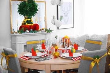 Table served for Christmas dinner in living room