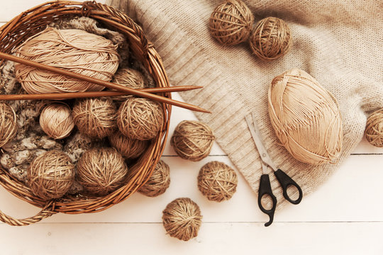yarns for knitting on a wooden table