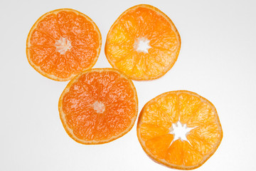 fresh and ripe oranges as cut on blue backgrounds