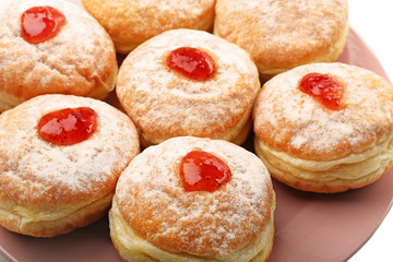 Close up view of plate with tasty donuts. Hanukkah celebration concept