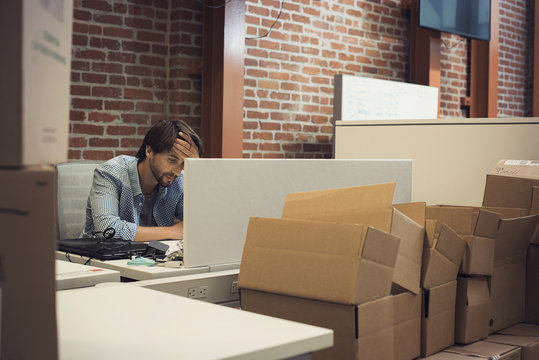 desperate businessman working in office