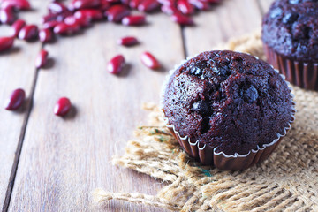 Close up of red kidney beans chocolate cup cake on a wooden table.
