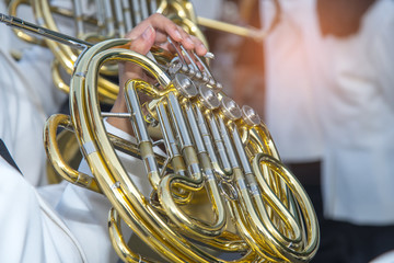 Fototapeta premium A girl playing tuba on footpath , Marching Band