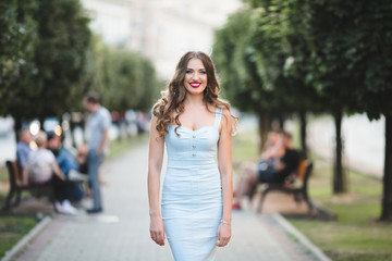 The future bride with ears stands in the center of alley