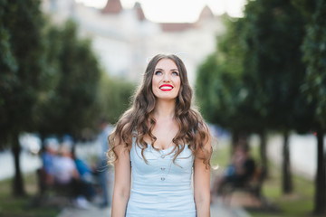 The future bride with ears stands in the center of alley