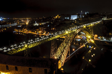 Fototapeta na wymiar night sight the city of Oporto in Portugal, with the bridge luis 1 and the river Douro