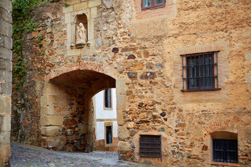 Fototapeta na wymiar Arco de Santa Ana arch in Caceres of Spain