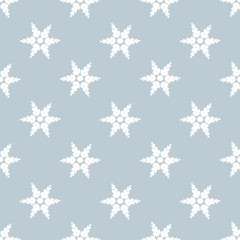 Fototapeta na wymiar Beautiful white snowflakes on a gray background