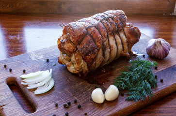 Roasted pork roll stuffed with vegetables and garlic