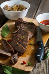 Grilled piece of beef and sauces