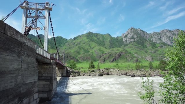 Suspension bridge over Katun river in Altay, Russia.