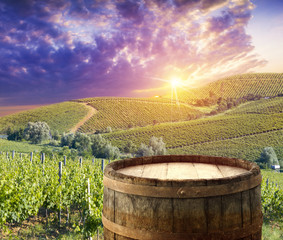 White wine with barrel on vineyard in Chianti, Tuscany, Italy