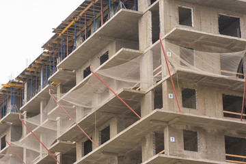 Protective guard from falling objects during the construction of multi-storey residential building
