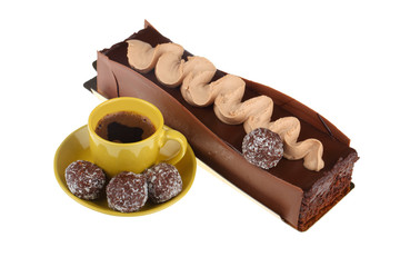 chocolate cake with cup of coffee and chocolate balls