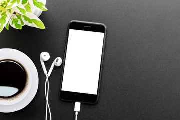 phone and headphones on table top view