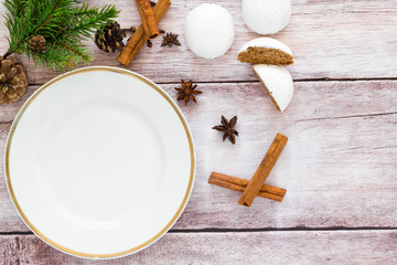 Christmas table setting with gingerbread cookies around it. Top view.