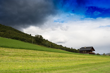 Fototapeta na wymiar Classic Norway cottage landscape background