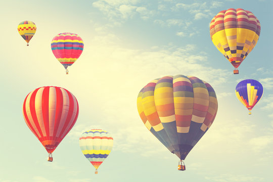 Hot air balloon on sun sky with cloud, vintage and retro instagram filter effect style