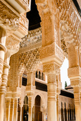 Mosaic walls and columns at the Alhambra Palace.