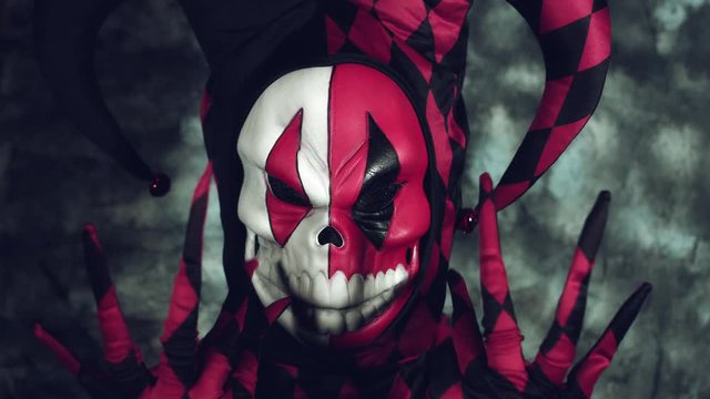 4k Halloween Shot of a Child in Joker Costume Showing Fingers