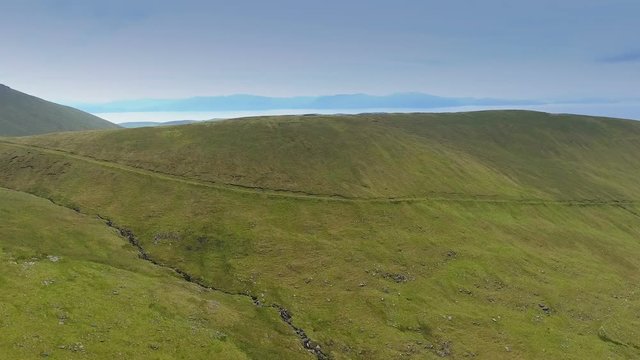 Landscape view of the brown mountain seen in Skyroad while travelling along the road on the side of the mountain in Ireland