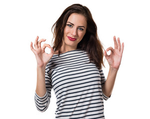 Pretty young girl making OK sign