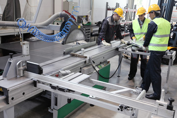 Workers in CNC machine shop