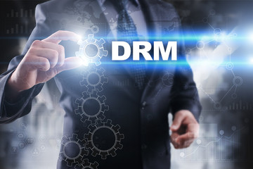 Businessman selecting drm on virtual screen.
