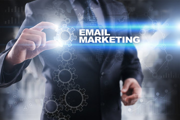 Businessman selecting email marketing on virtual screen.